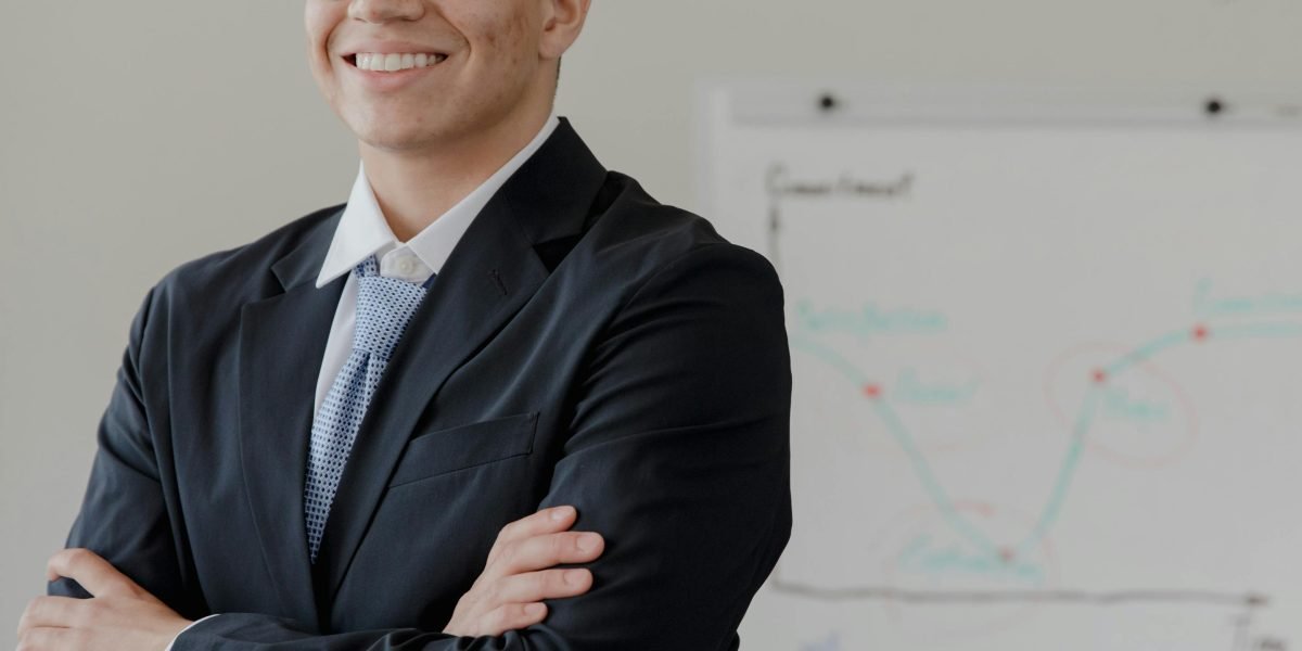 A confident professional smiling, reflecting high job satisfaction and successful outcomes from efficient work.
