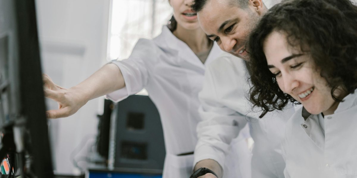 Researchers collaborate on a project, showcasing teamwork in advancing medical technology.
