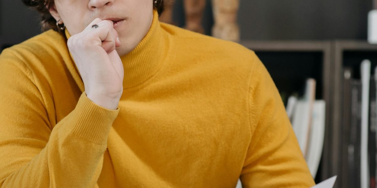 A person deep in thought at an office desk, symbolizing the critical evaluation needed when selecting quantum computing partners.