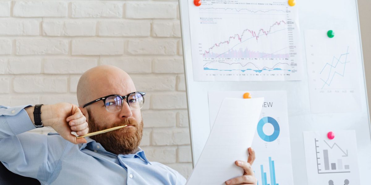 A person contemplating strategic choices, representing the process of selecting the right AI vision technology.