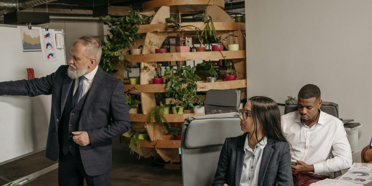 A group of professionals collaborating to develop a new growth strategy, possibly after an acquisition.