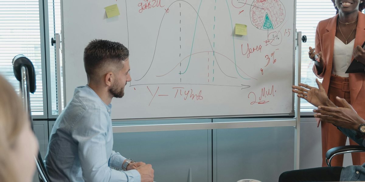 A scene showing professionals collaborating at a whiteboard, reflecting strategic planning for AI adoption.