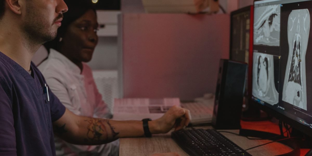 Medical professionals examine digital images, illustrating the application of real-time AI in diagnostics and patient care.