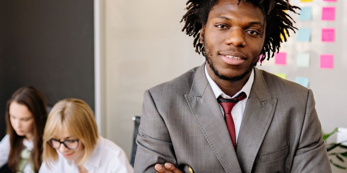 A person looking thoughtful and confident in a professional meeting setting, symbolizing clarity gained from understanding complex terminology.