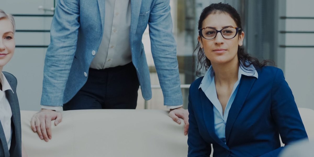 Business leaders making informed strategic decisions, leveraging the silent insights of invisible AI.