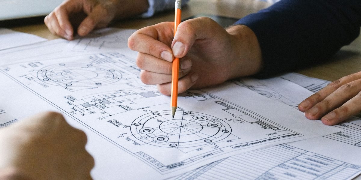 A professional thoughtfully reviewing documents or a strategic plan, making informed decisions based on clear definitions.