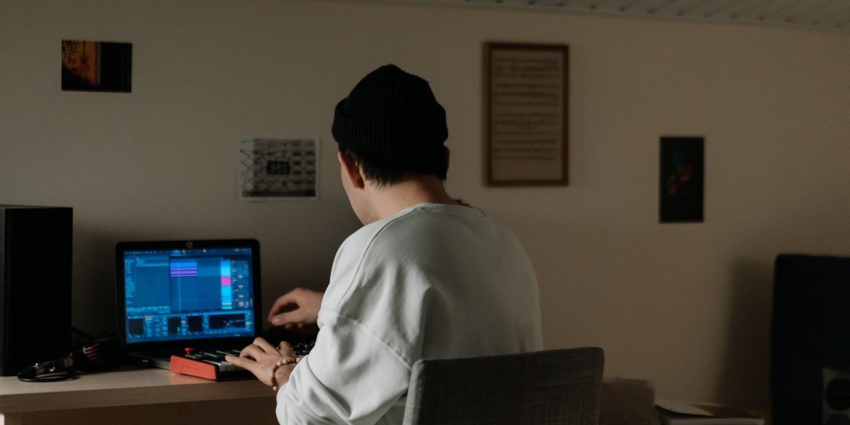 A musician or sound designer crafting audio, enabled by modern tools.