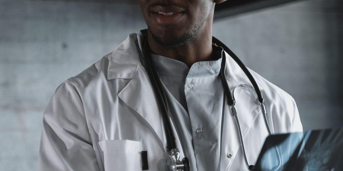 A medical professional confidently using technology to review patient data, enhancing diagnostic accuracy and care.