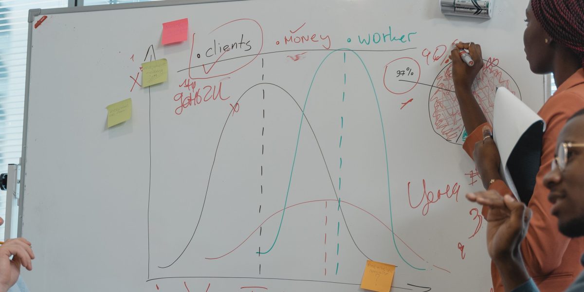 A team collaborates in a meeting, brainstorming strategies and making decisions, highlighting the business-centric nature of IS.
