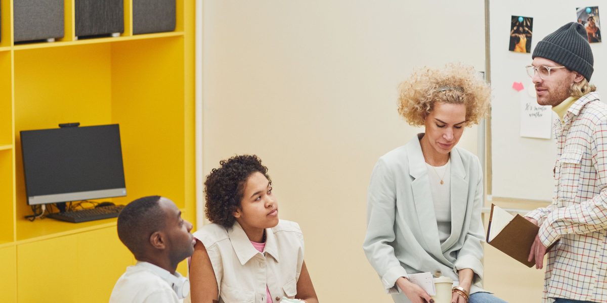 Diverse team members collaborate to understand complex concepts.