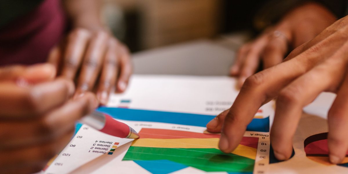 A team collaborates to analyze audit findings, prioritizing efforts based on user impact and strategic goals.