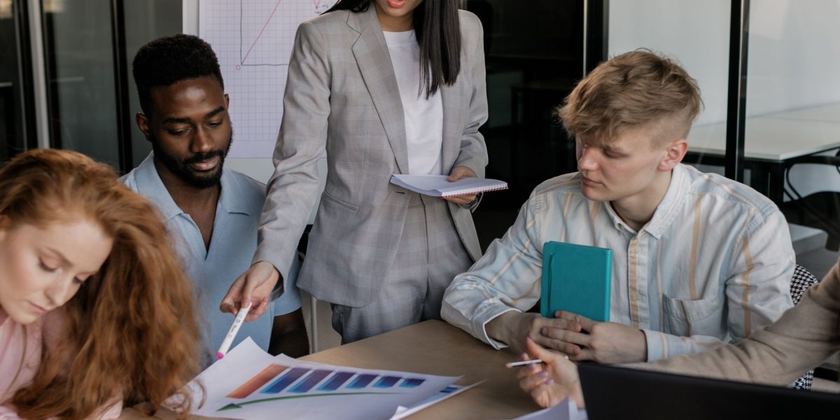 Professionals in a meeting setting, actively discussing future technology trends and their strategic implications for business.