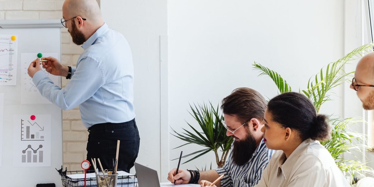 A diverse team collaborating, planning for future growth and adapting to technological shifts.