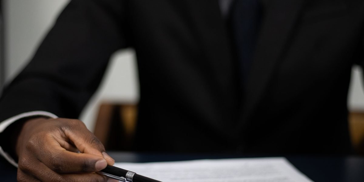 Executives carefully reviewing legal documents, representing the importance of regulatory compliance in the tech industry.