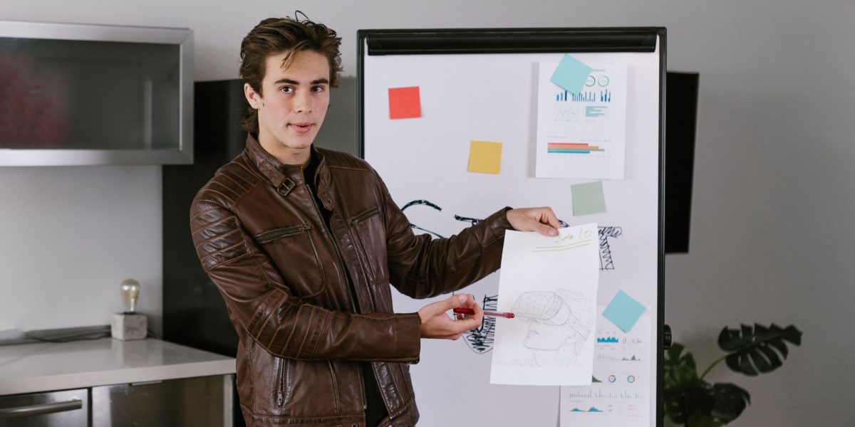 A person effectively communicating complex technological concepts to a diverse audience.