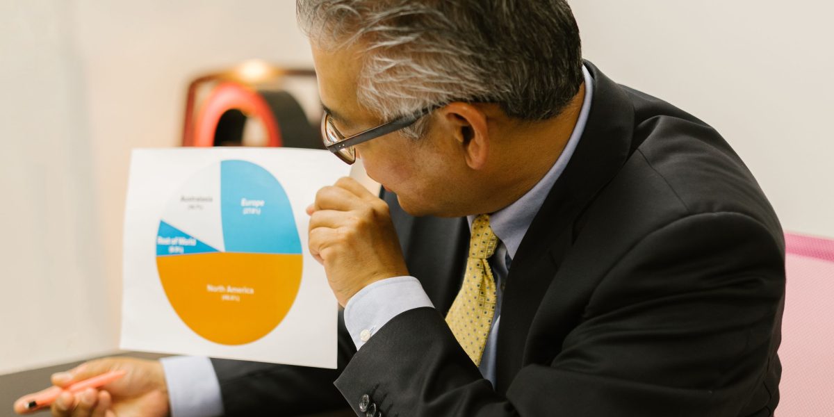 A professional reviewing performance reports and data, signifying the importance of measuring ROI and KPIs for technology investments.