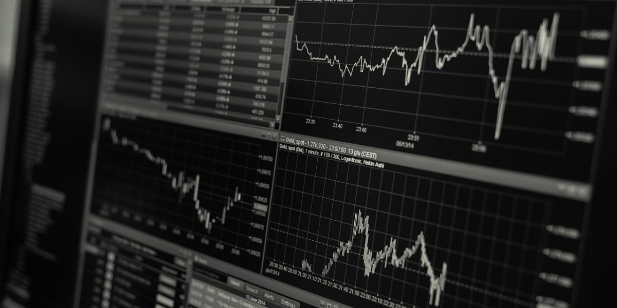 Executives examining data charts and reports, signifying the process of measuring project impact and return on investment.