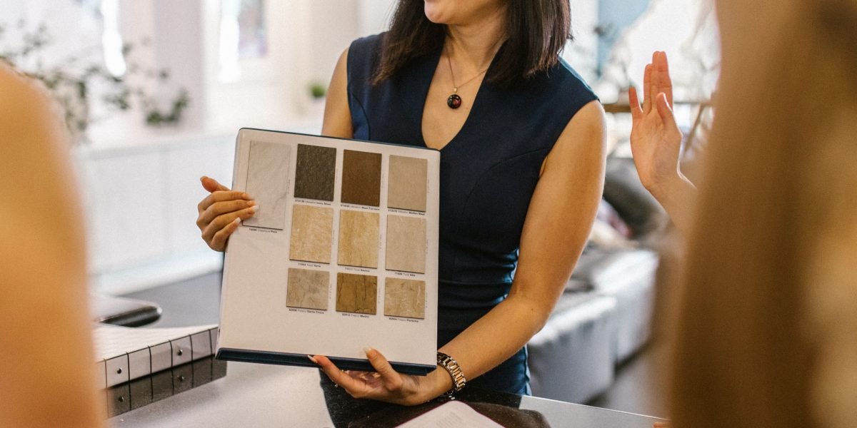 A designer collaborating with a client, blending human creativity with AI-powered insights for optimal design.