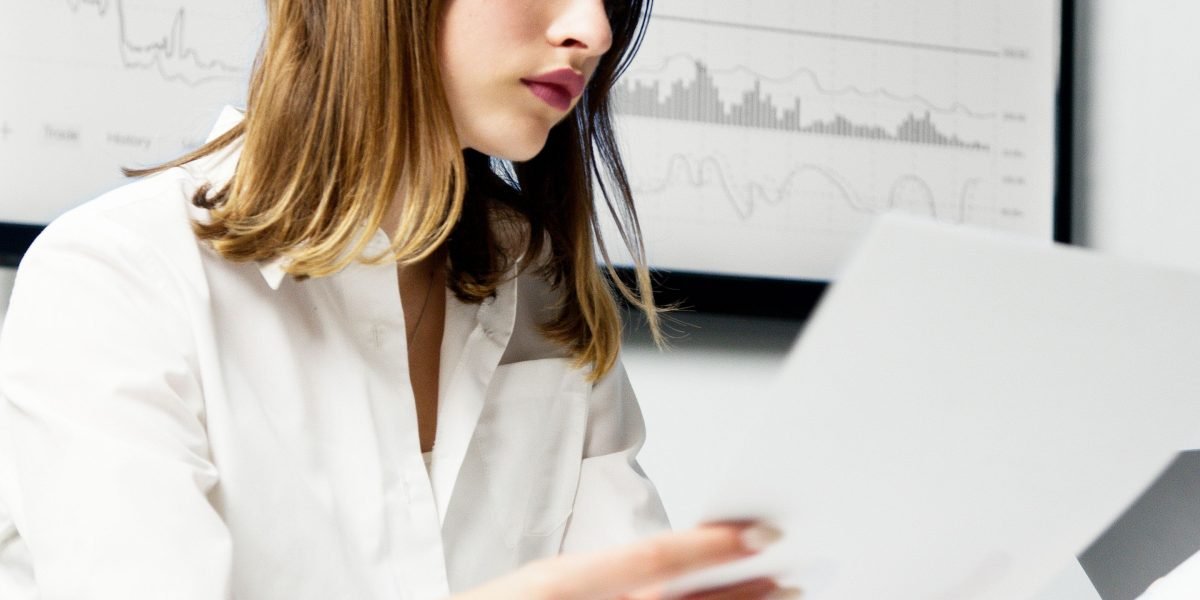 A person carefully comparing different options, illustrating the process of evaluating technology solutions.