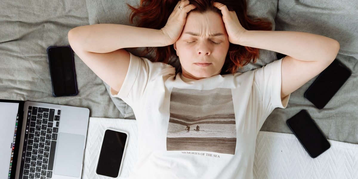 A person feeling overwhelmed by too much information, representing the challenge of finding suitable technology.