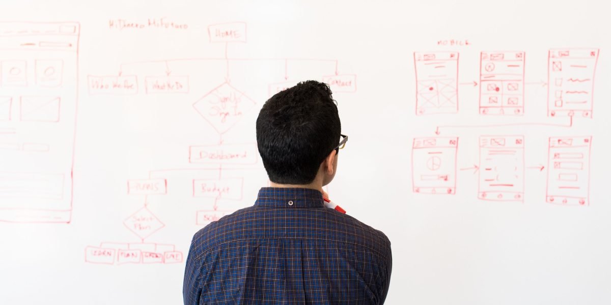 A business professional thoughtfully reviewing strategic documents, symbolizing confident decision-making for future partnerships.