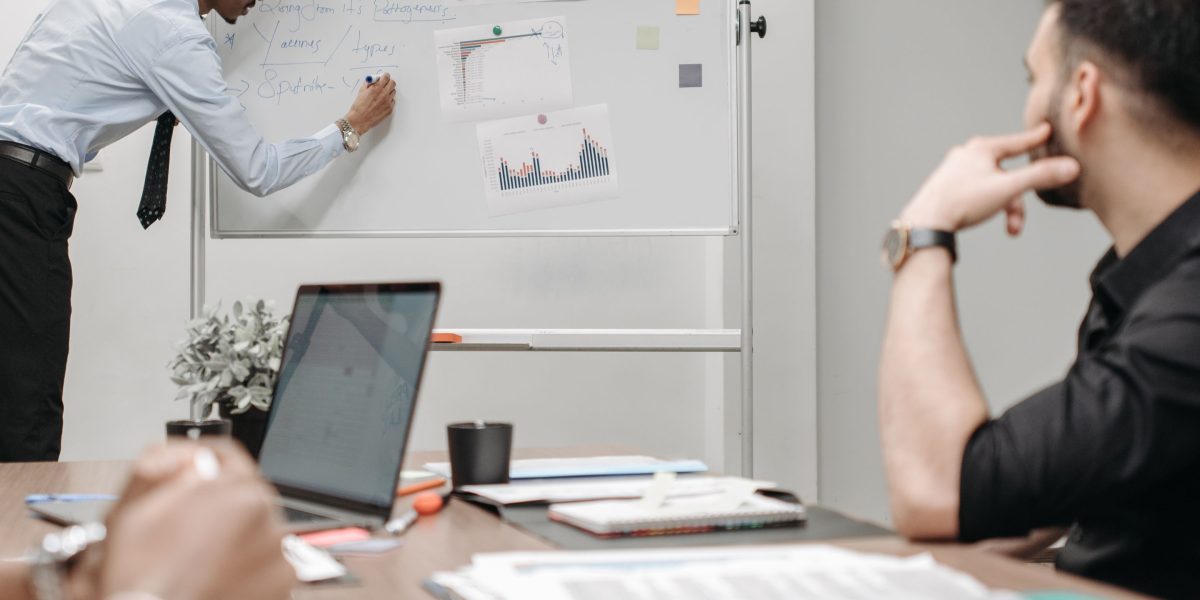 A team collaborates, symbolizing businesses seeking smart ways to improve operations and customer experience with virtual assistants.
