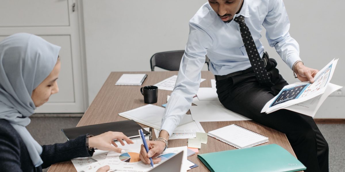 Professionals engaged in a detailed discussion, representing the thoughtful process of evaluating and selecting a virtual assistant company.