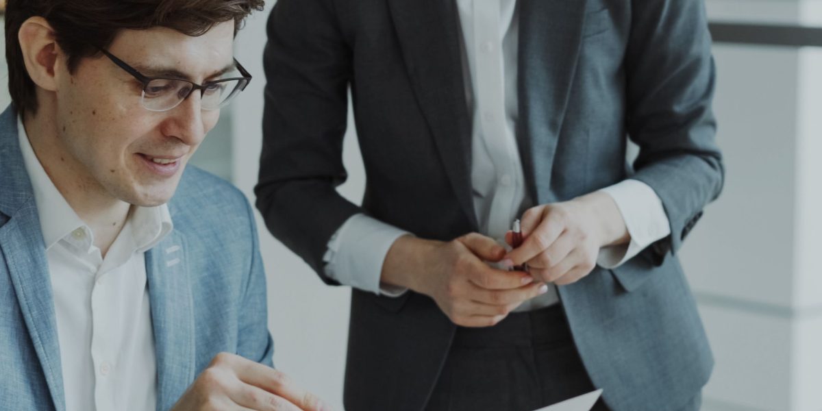 A professional meticulously examining legal documents, symbolizing the critical focus on security, privacy, and compliance for virtual assistants.