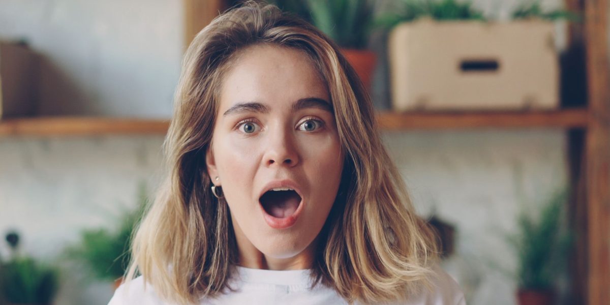 A person reacting to unexpected content access changes, reflecting user frustration with shifting paywall policies.
