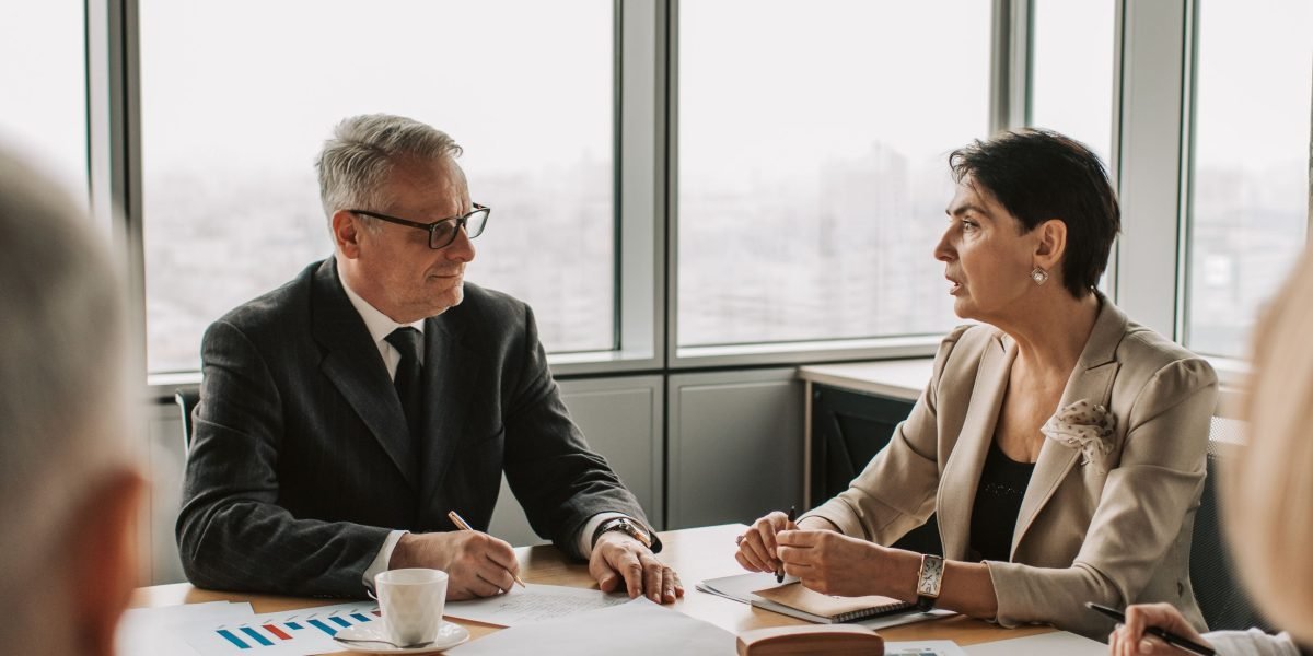 Leaders engage in a strategic discussion about integrating diverse AI tools for a cohesive ecosystem.