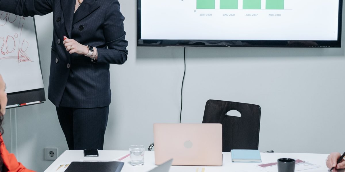 A group of professionals engaged in a strategic discussion, reflecting the high-level insights from tech leaders.